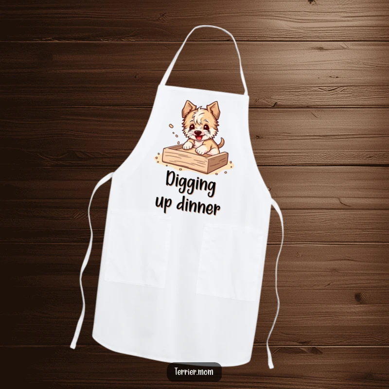 Funny Apron with a terrier happily digging in a sandbox, dirt flying, perfect for the playful chef.