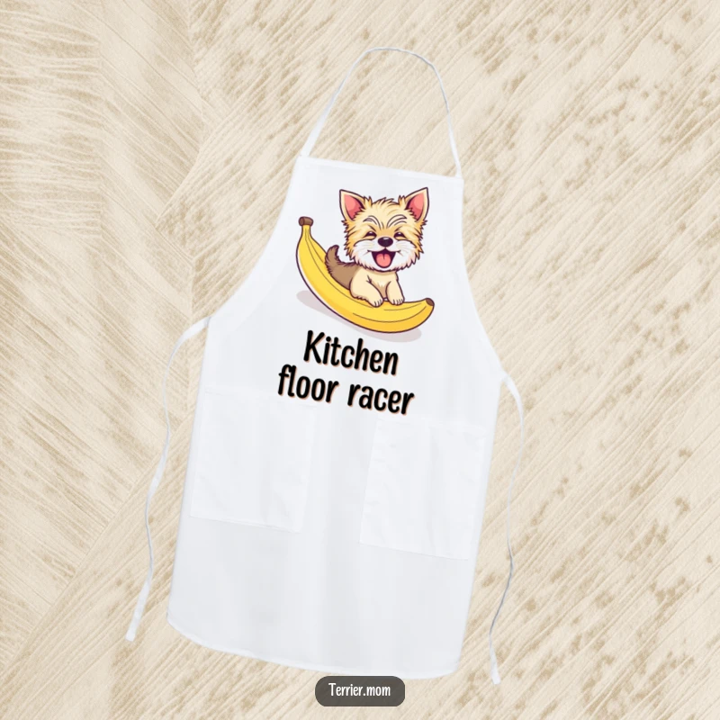 Funny apron with a giggling Terrier dog comically sliding down a banana peel, perfect for cooking with humor and style.