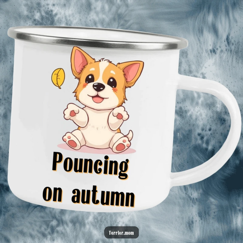Funny Terrier Camping Mug: A durable enamel mug showing a playful terrier with paws outstretched attempting to catch a falling leaf, for outdoor use.