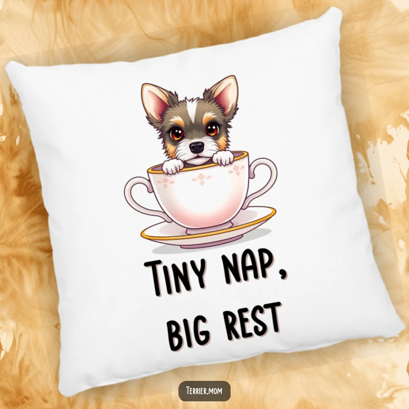 Funny terrier with bright eyes peeking from a miniature teacup, on a soft, decorative pillow.