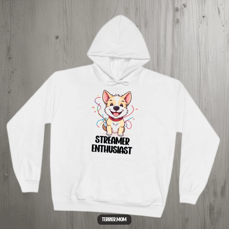 Funny hoodie with a cheerful terrier grinning and holding colorful streamers, ideal for staying warm and festive.
