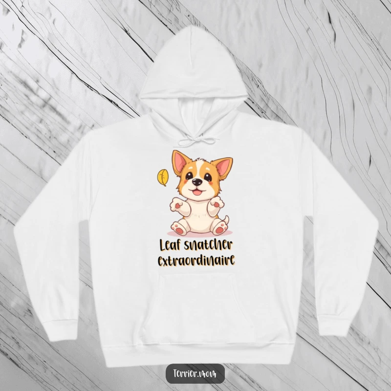 Funny Terrier Hoodie: A cute terrier with paws outstretched comically tries to catch a falling autumn leaf, perfect for cozy days.