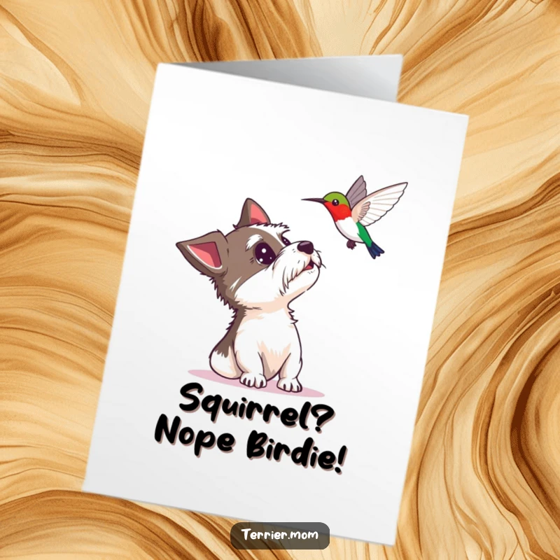 Funny Free Printable Birthday Card: A terrier looks up in delighted surprise at a hovering hummingbird, perfect for a joyous celebration.