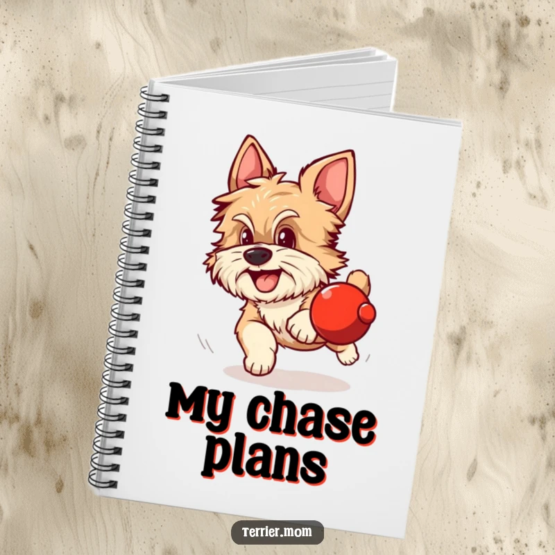 Funny notebook with a scruffy dog with alert ears excitedly chasing a rolling red sphere.