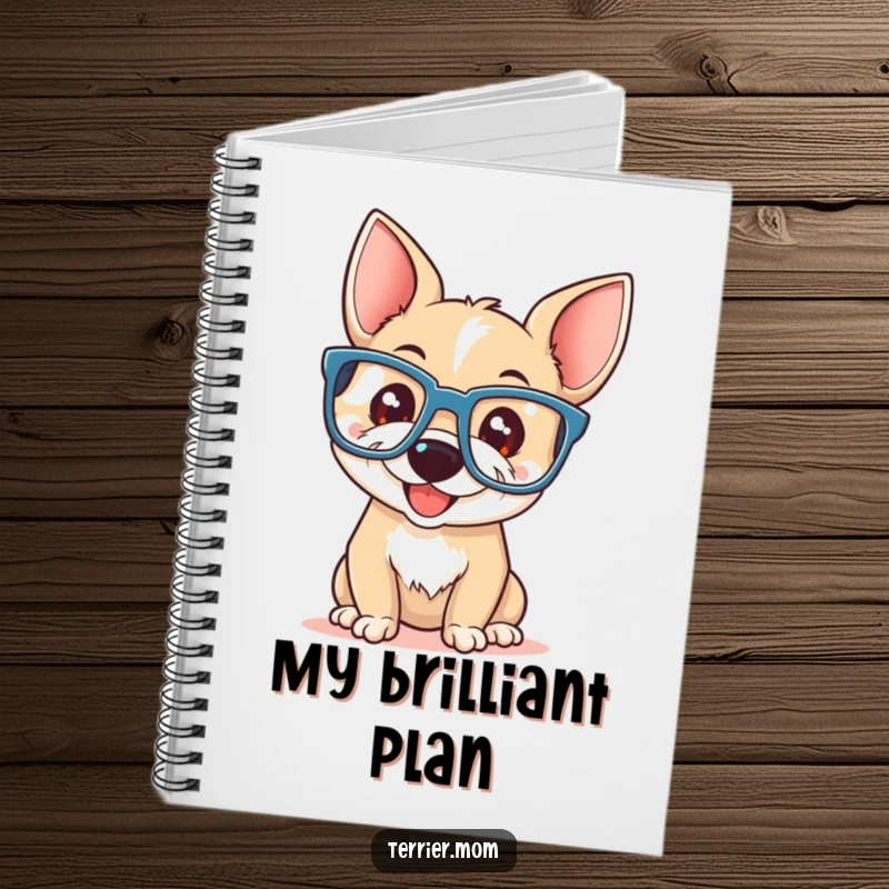 Funny terrier with a playful smile wearing oversized reading glasses, on the cover of a notebook.