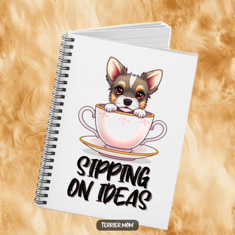 Funny terrier with bright eyes peeking from a miniature teacup, on the cover of a notebook.