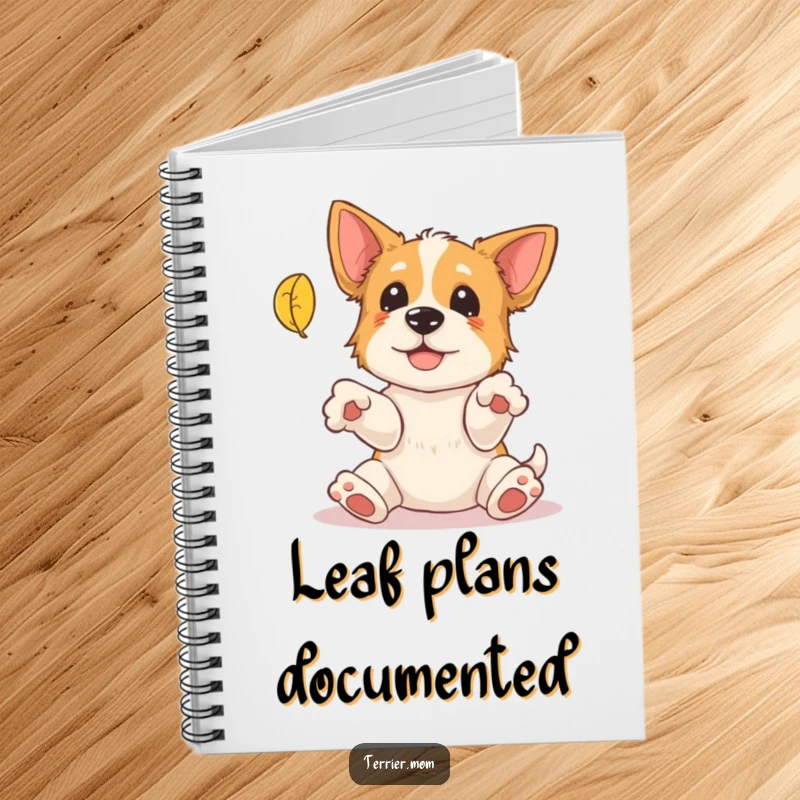 Funny Terrier Notebook: A playful terrier with outstretched paws humorously tries to catch a falling autumn leaf, ideal for notes and journaling.