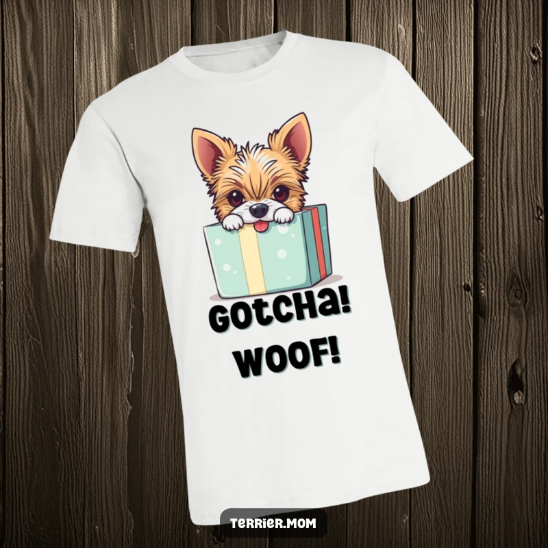 Funny t-shirt featuring a mischievous Terrier dog peeking playfully from inside an open gift box.