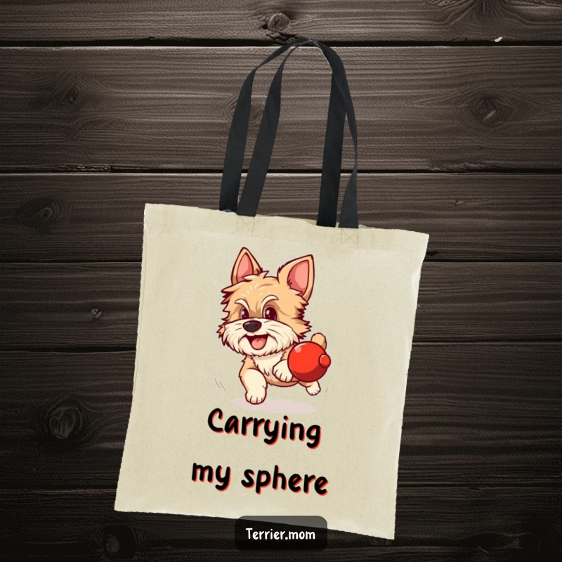 Funny tote bag depicting a scruffy dog with alert ears excitedly chasing a rolling red sphere.